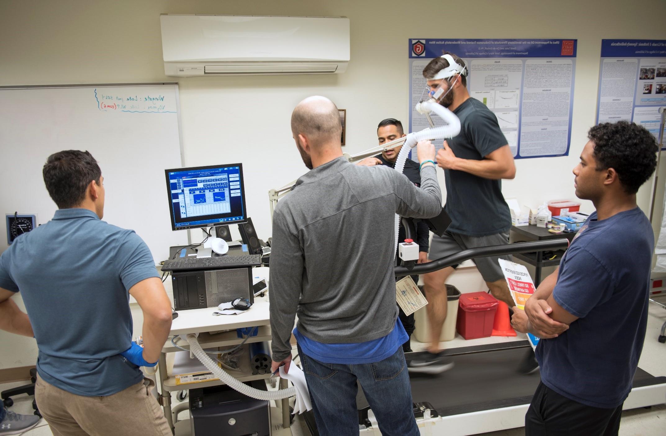 Five Saint Mary's Kinesiology students in the Human Performance Lab.